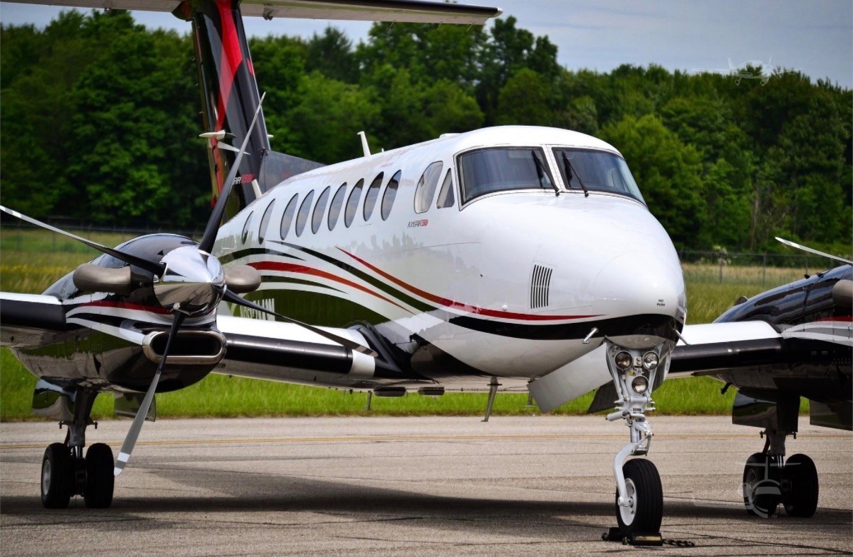 Beechcraft King Air 250 front quarter view on the ramp with props and airstair door