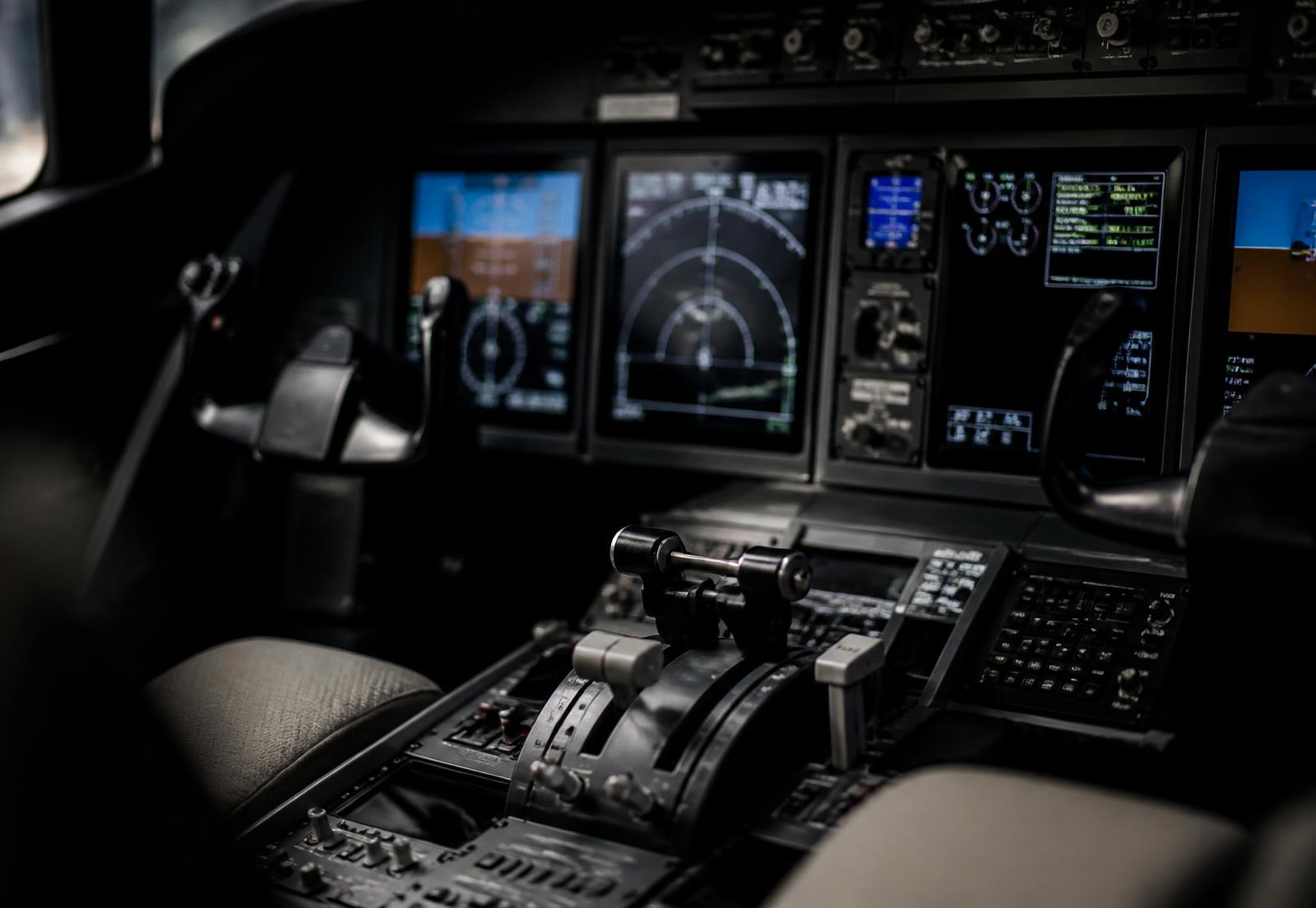 Close-up of a business jet avionics panel and throttle quadrant