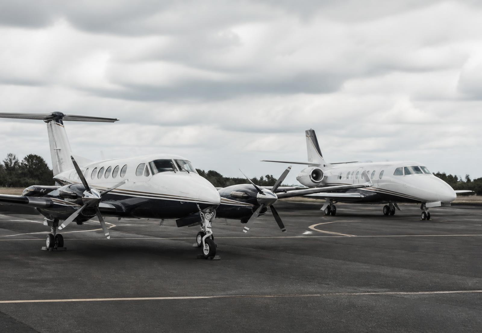 Mixed fleet of business aircraft parked on an apron
